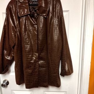 Faux leather  jacket with quilted interior.